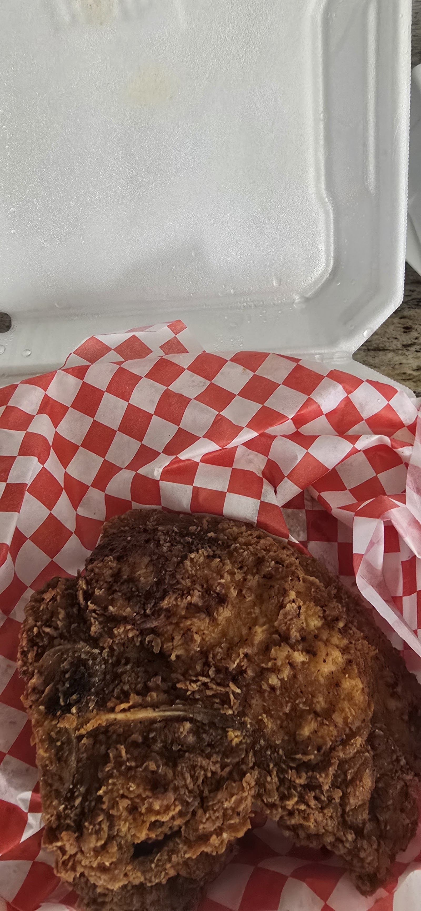 Golden fried pork chop served at Sauce's Southern Kitchen